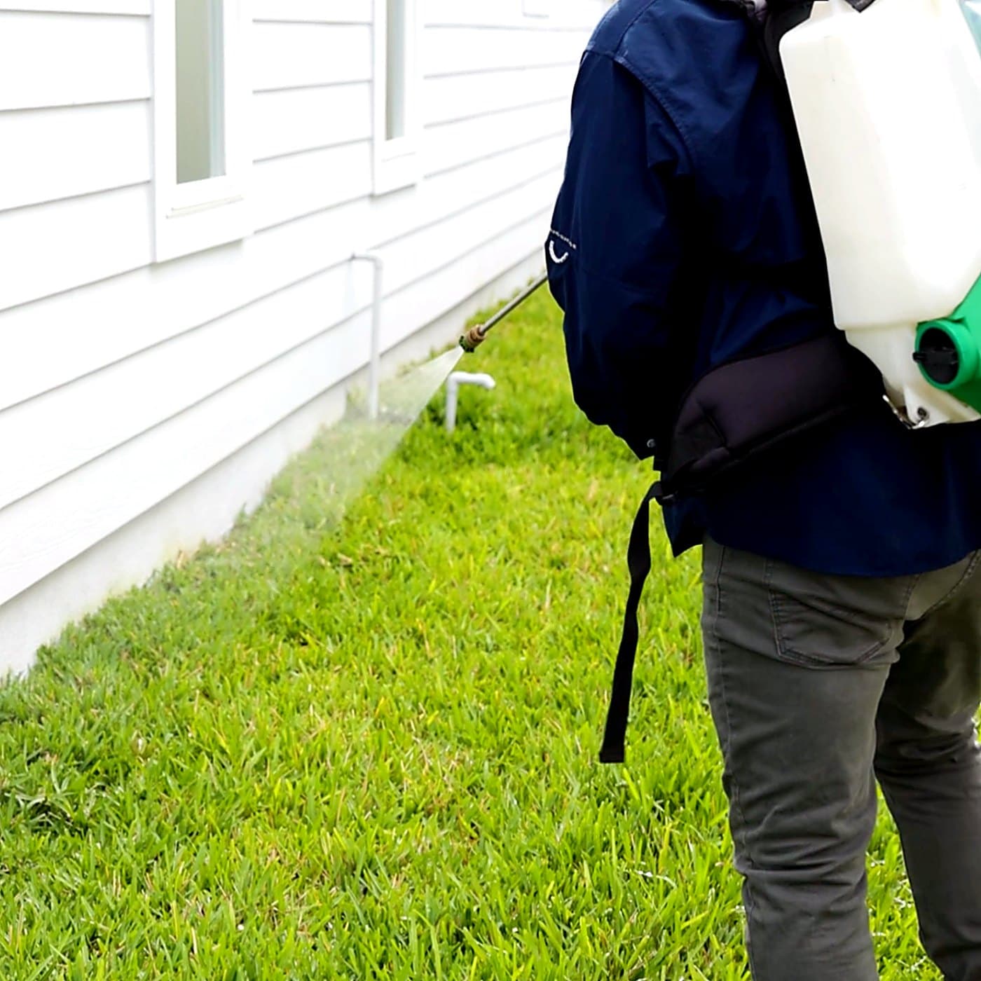 Gray Pest Control technician treating a Northeast Florida property for fleas and ticks